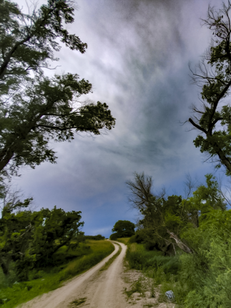 winding road and looming clouds