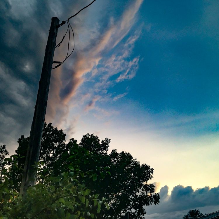 Blue sky with telephone pole